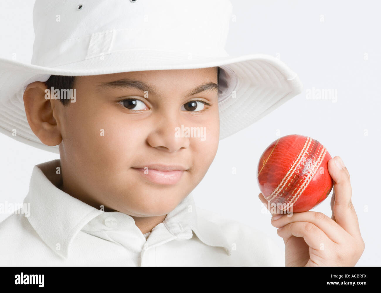 Portrait of a boy holding a cricket ball Stock Photo Alamy