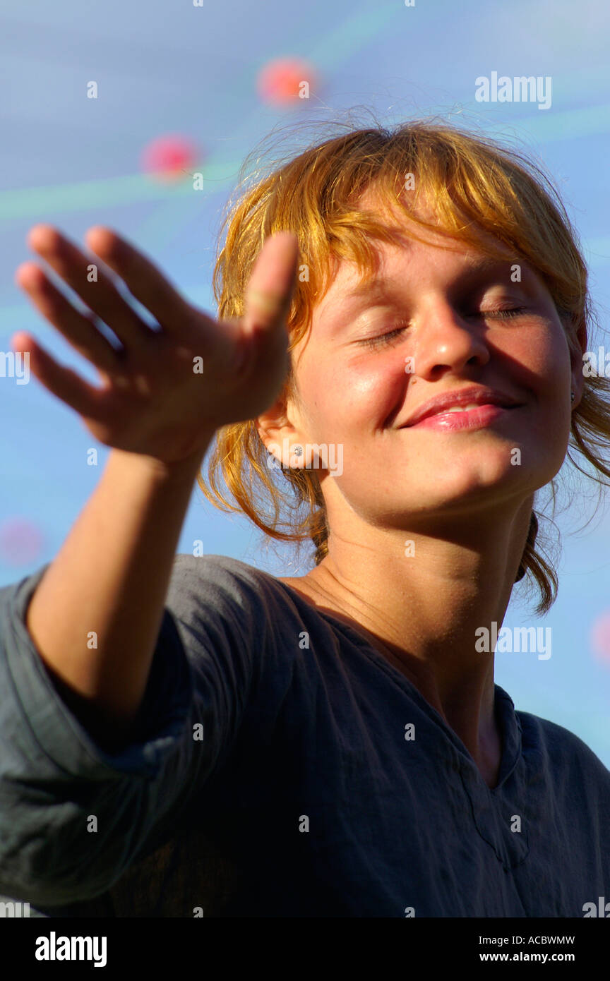 Happy teenage red head girl dancing at rave party Hilltop 2007 Stock ...