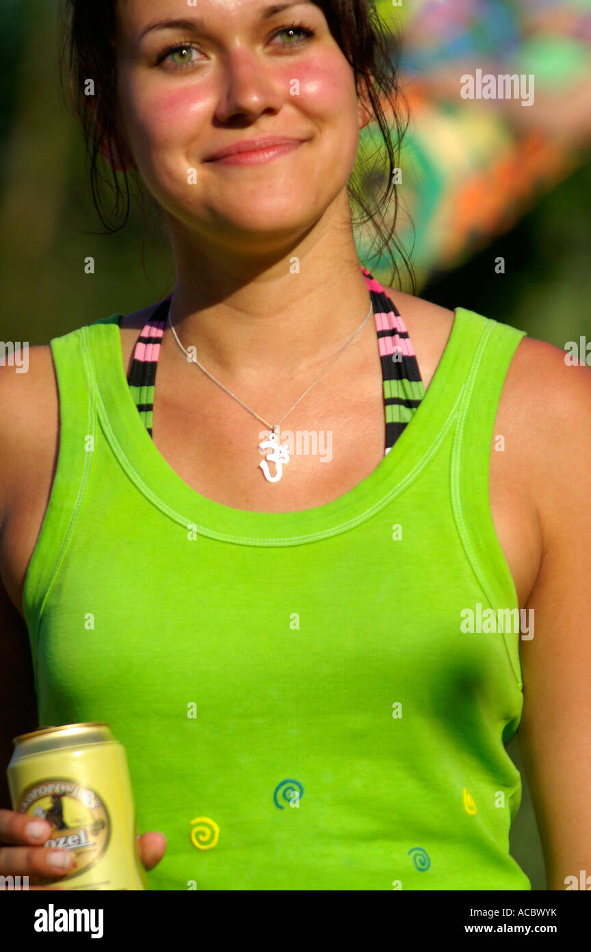 Slender teenage girl in green singlet dancing at rave party Hilltop ...