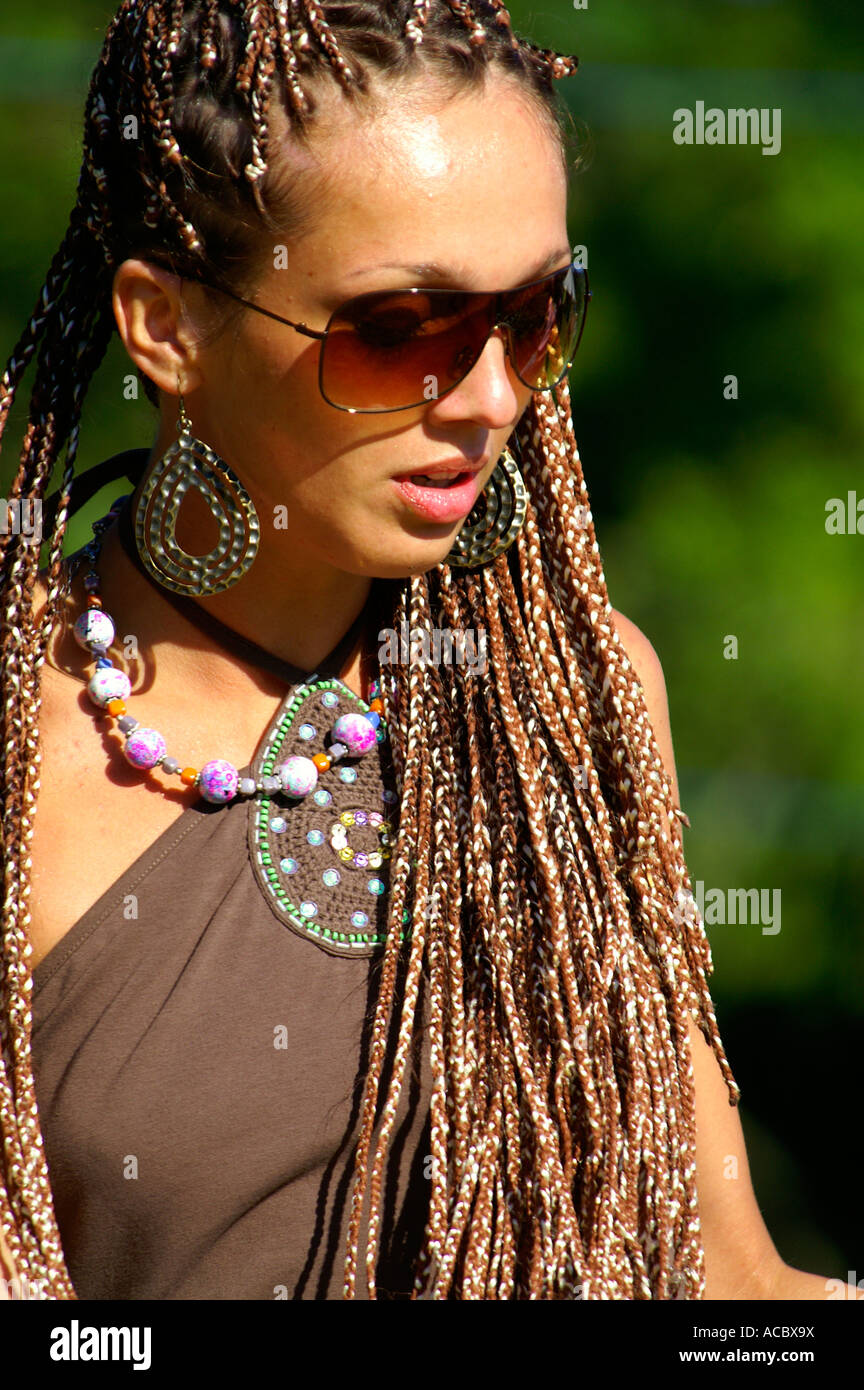 Happy teenage girl with long brown hair dancing at rave party Hilltop ...