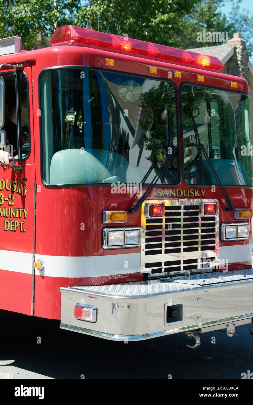 Current and vintage historic fire trucks at Independence Day parade at Lexington Michigan Stock