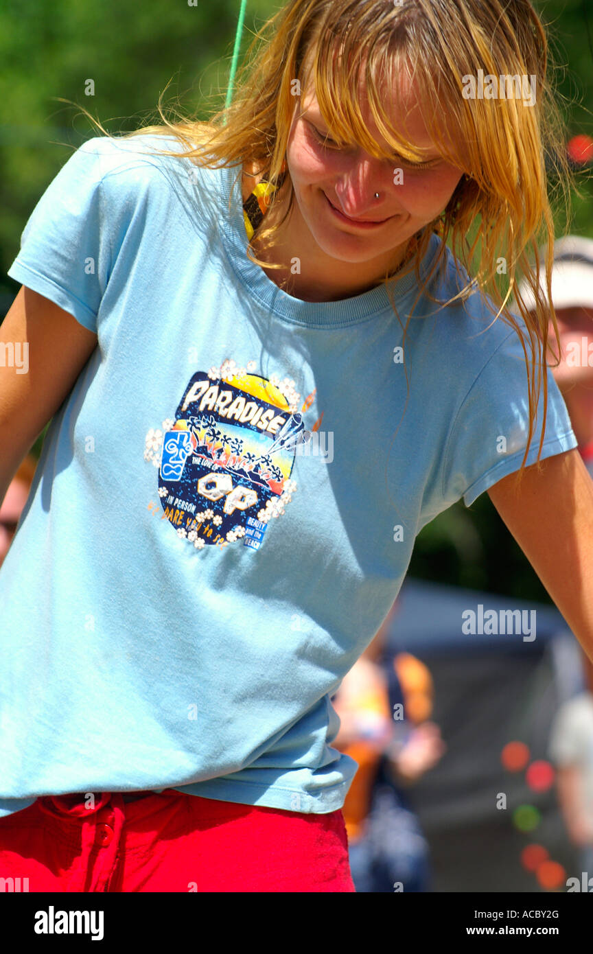 Happy teenage blonde girl dancing at rave party Hilltop 2007 Stock ...