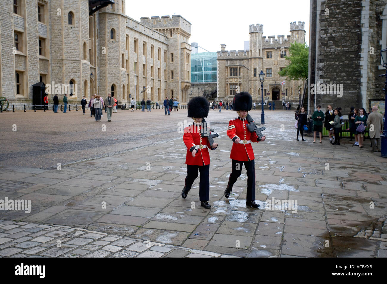Two Royal Guards marching across at the Tower of London UK Stock Photo