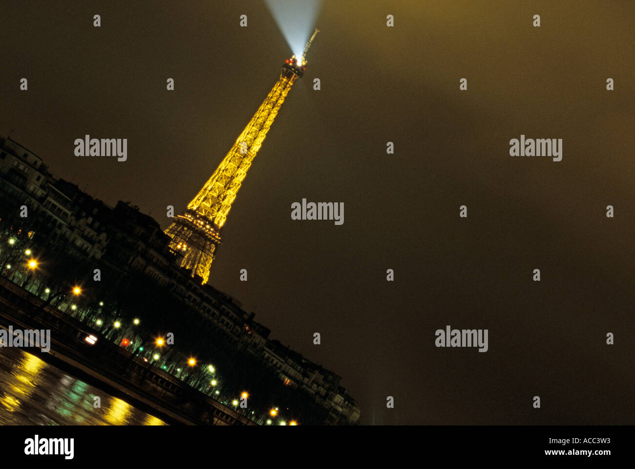 The Eiffel Tower lights up the skyline of Paris at night Stock Photo Alamy