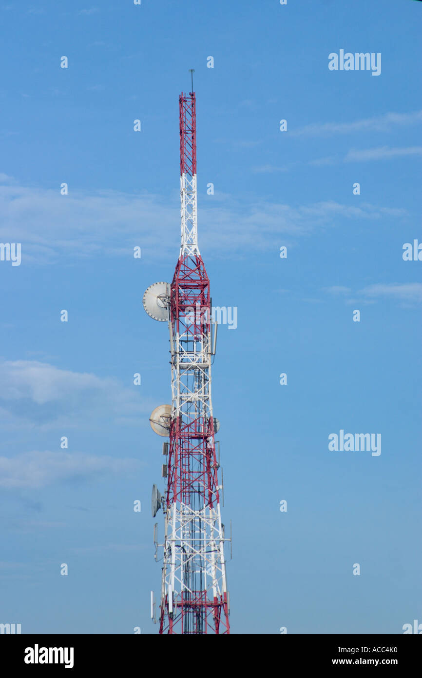 telecommunications antenna tower against blue sky Stock Photo