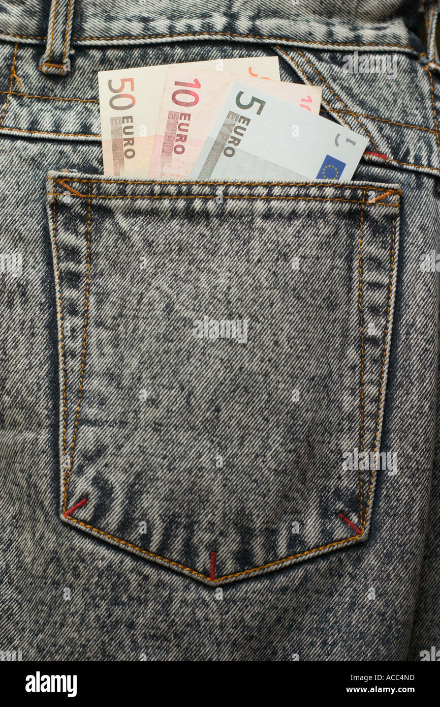 euro dollar bills in jeans back pocket Stock Photo - Alamy