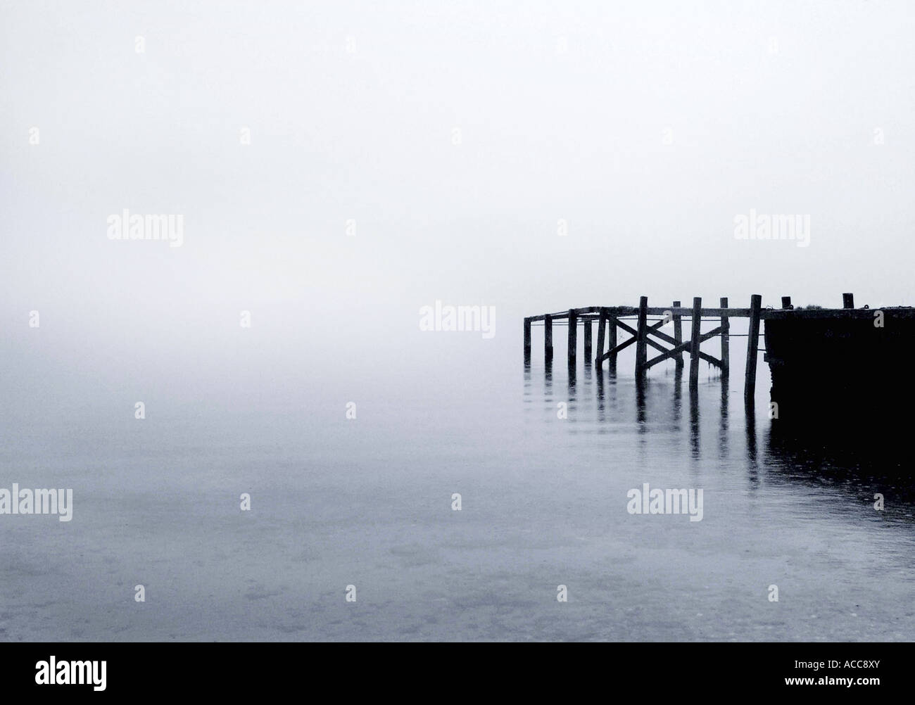 Old wooden Jetty on Loch Lomond, on a misty morning, Highland Scotland Stock Photo