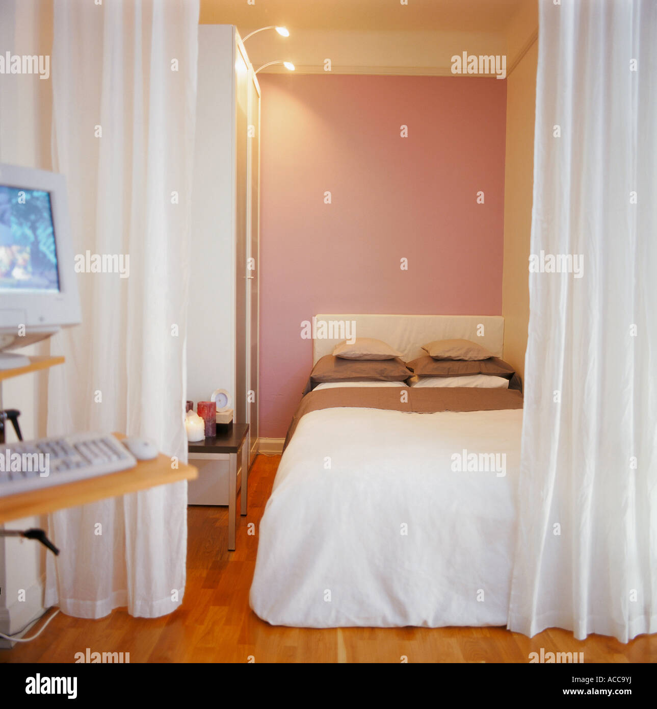 A bed in a bedroom Stock Photo - Alamy