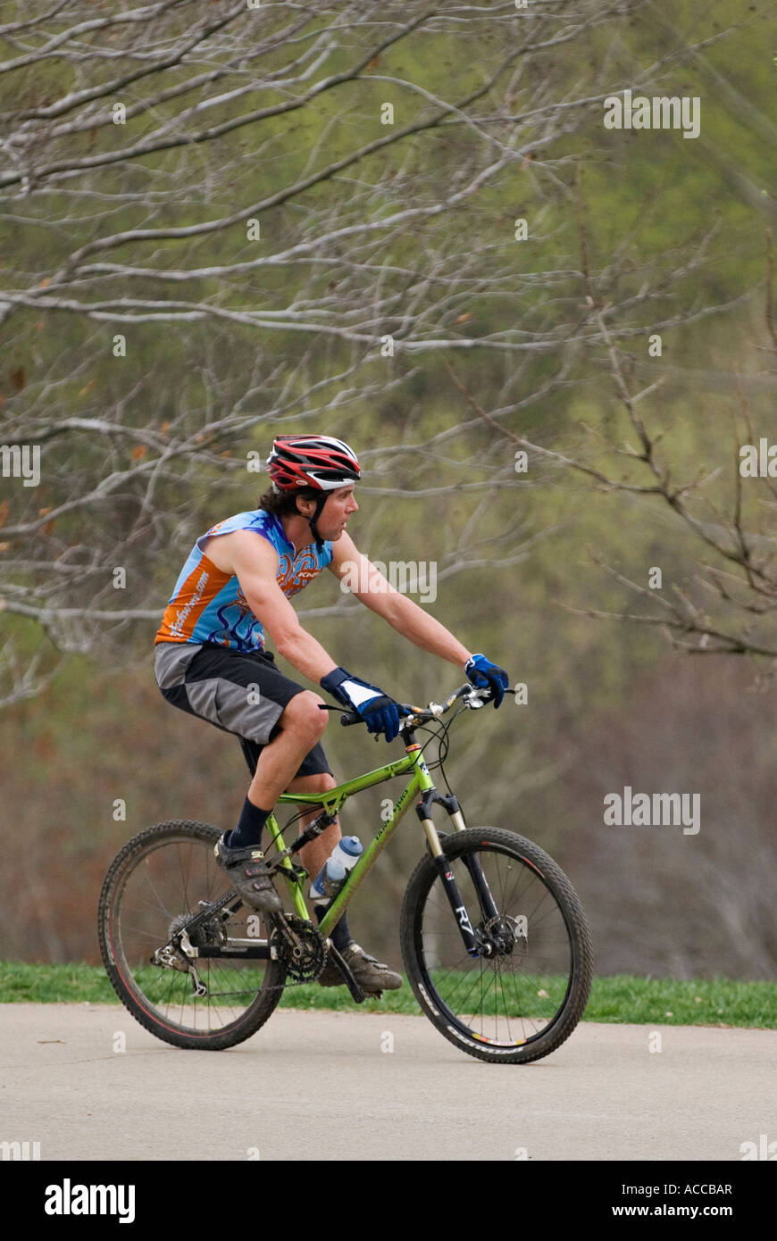 Young Man Riding Mountain Bike through Park Cherokee Park Louisville
