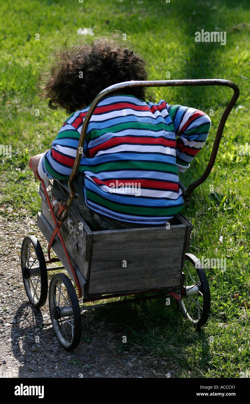 A boy with a toy wagon hi-res stock photography and images - Alamy