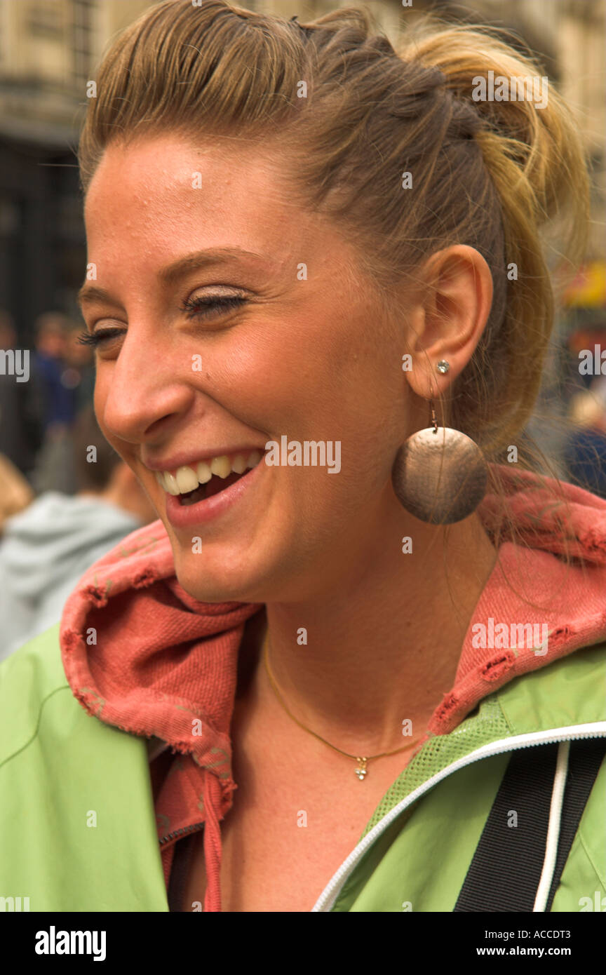 Informal head and shoulders portrait of happy excited young  woman Stock Photo
