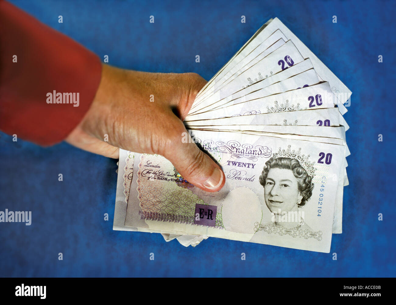 hand holding UK pound banknotes Stock Photo Alamy