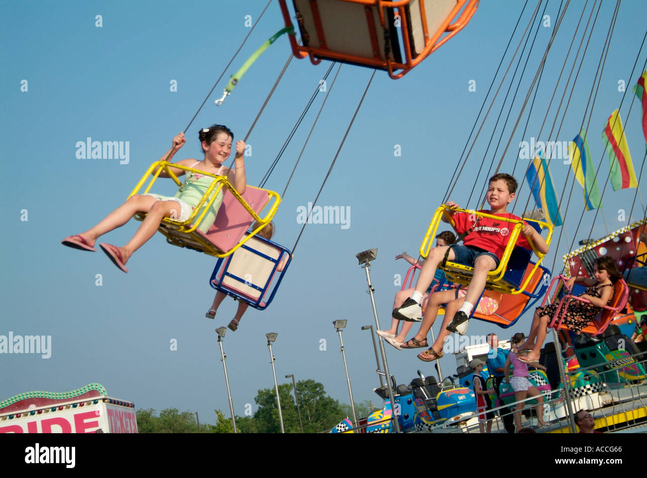Baby Rides Fair Children enjoy thrilling rides at a carnival Stock Photo - Alamy