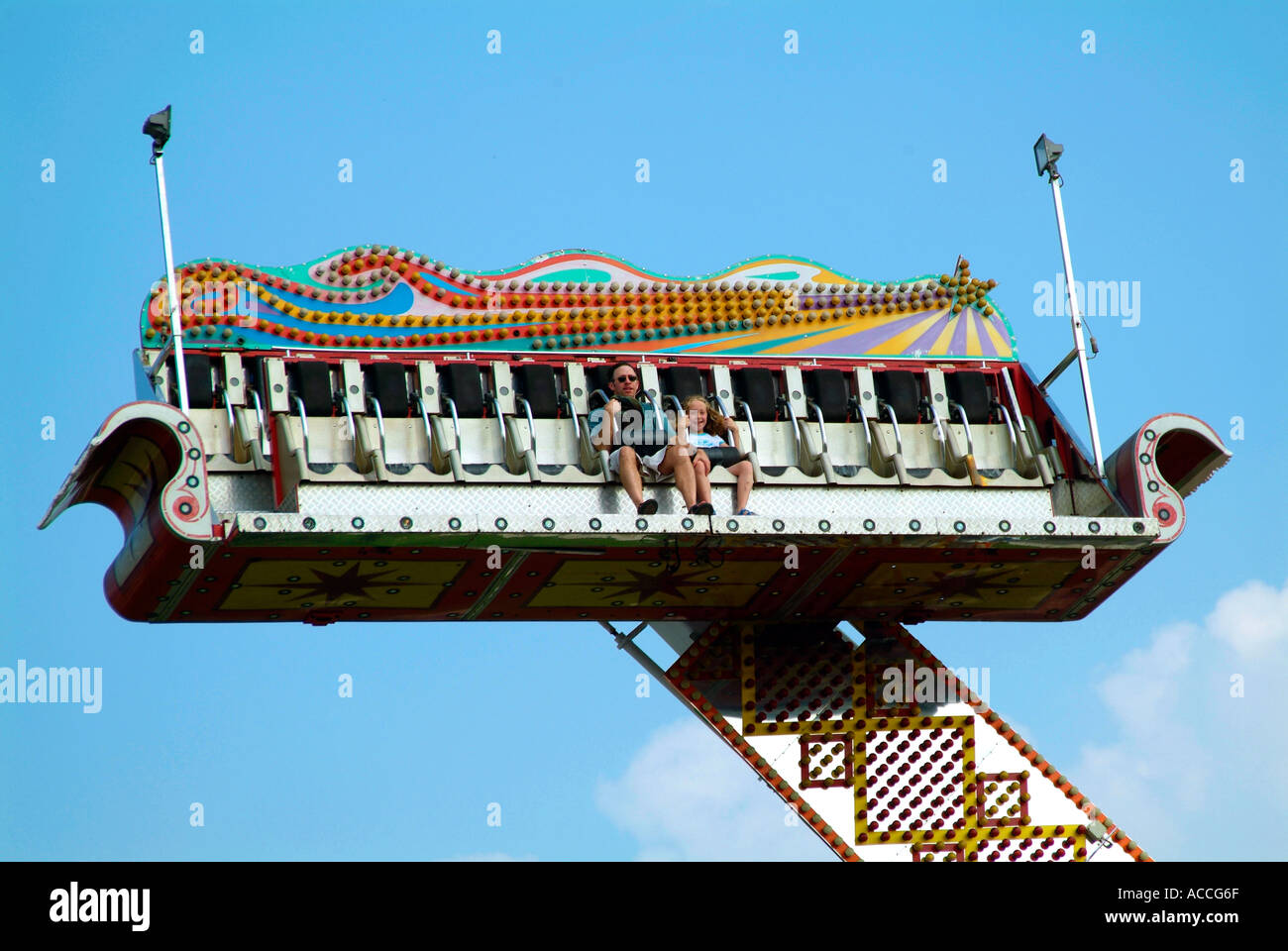 Father and daughter enjoy thrilling ride at a carnival Stock Photo - Alamy