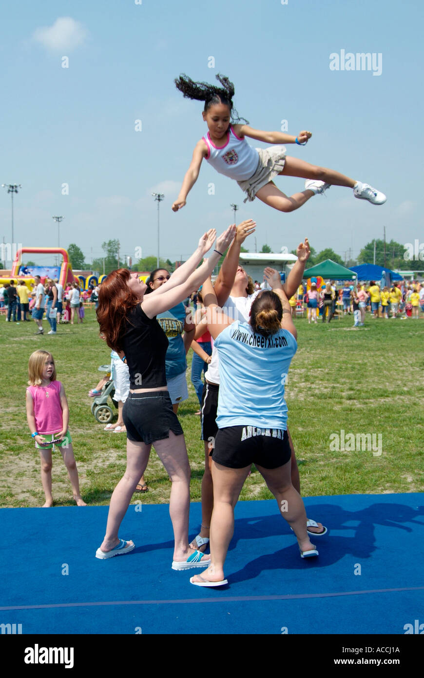 8 year old girl demonstrates cheerleading gymnastics at Childs