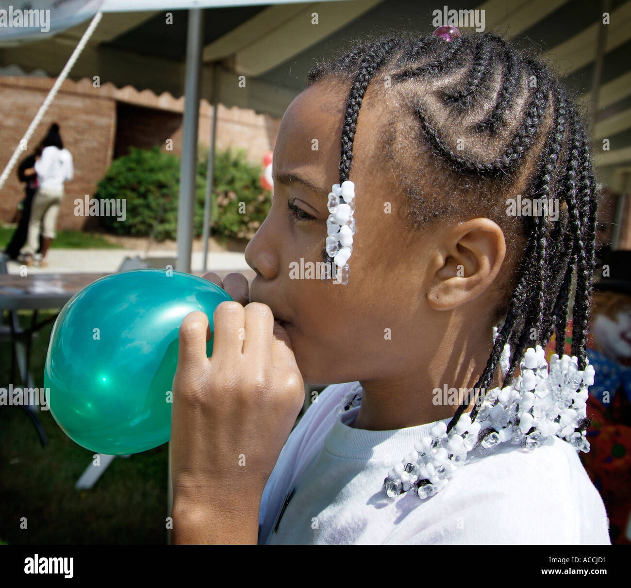10 Year Old Black Ethnic Girl Blows Up And Plays With Balloon