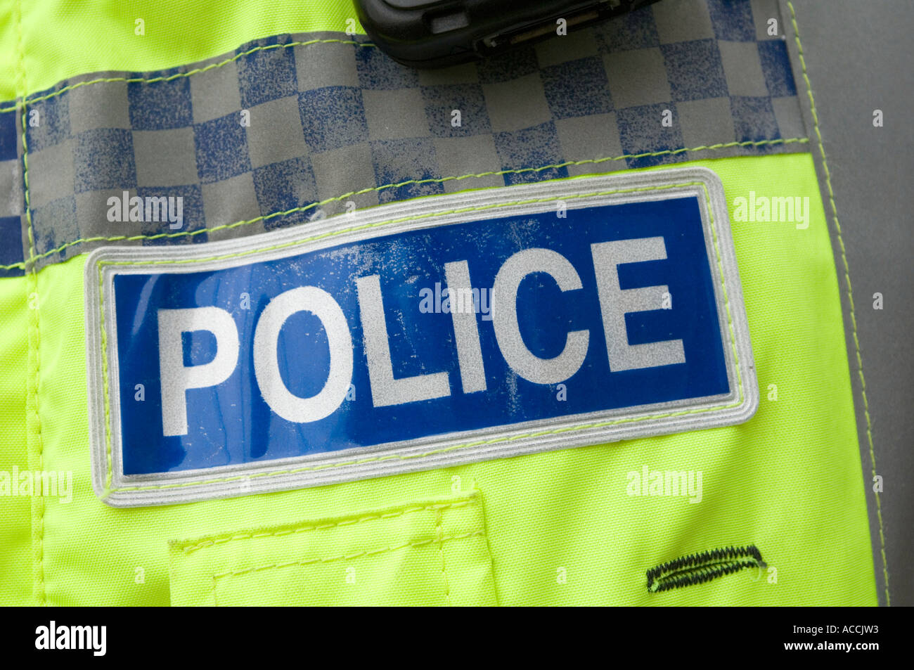 a police officers reflective badge on their uniform Stock Photo