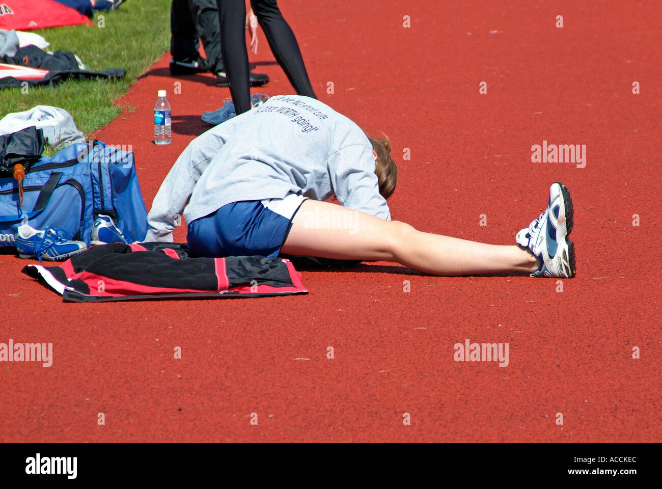 High School Track and Field Events stretching muscles before racing