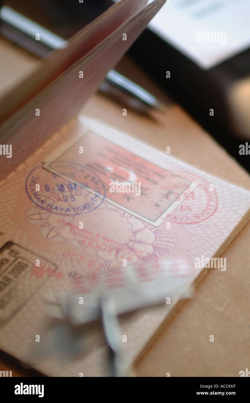 an open united kingdom passport with immigration stamps in it Stock Photo