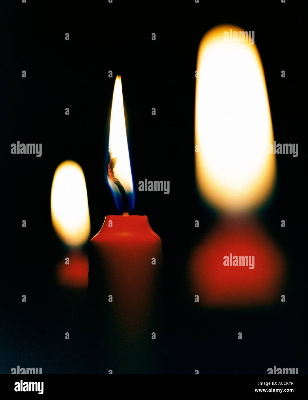 Red candles against a black background Stock Photo Alamy