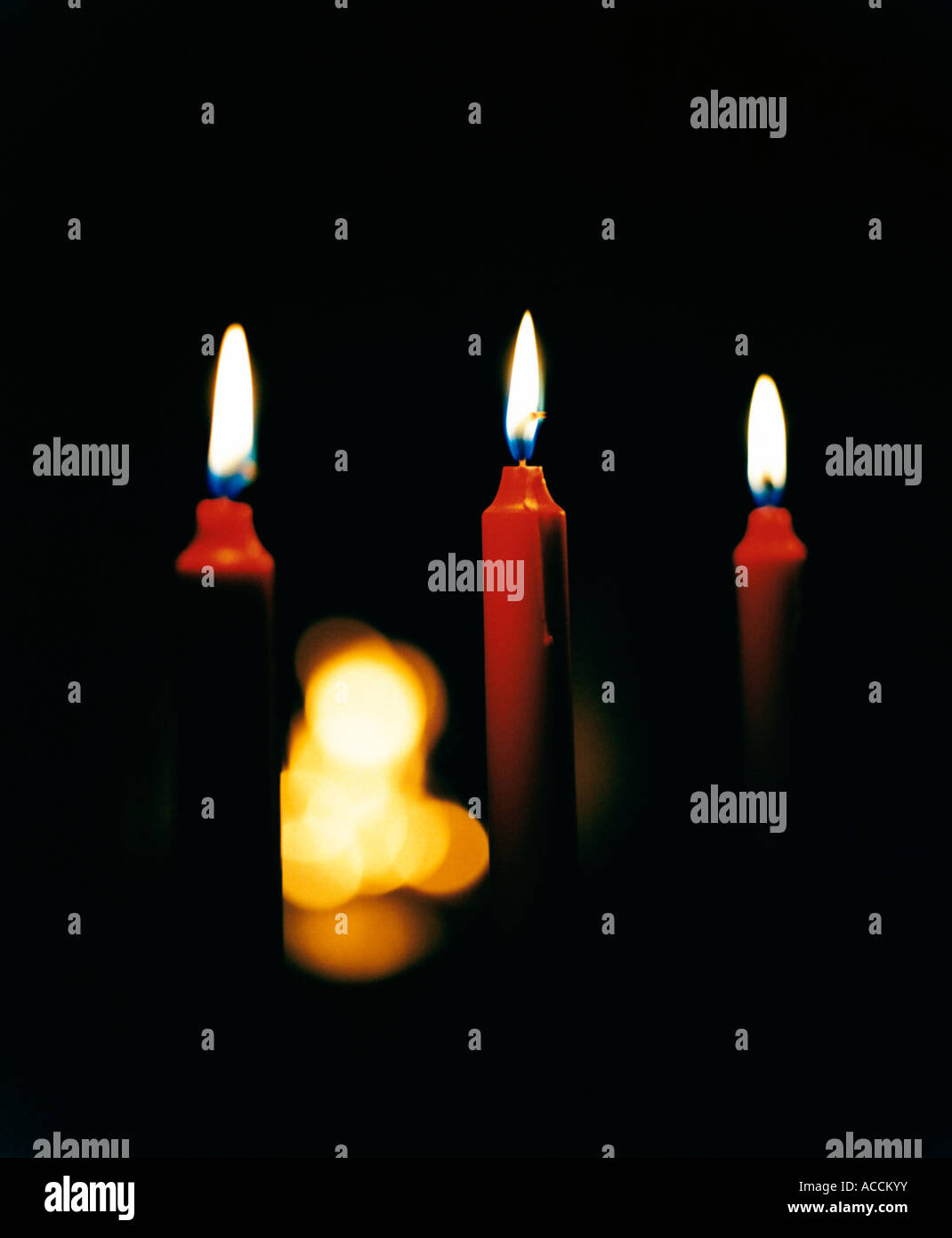 Red candles against a black background Stock Photo Alamy
