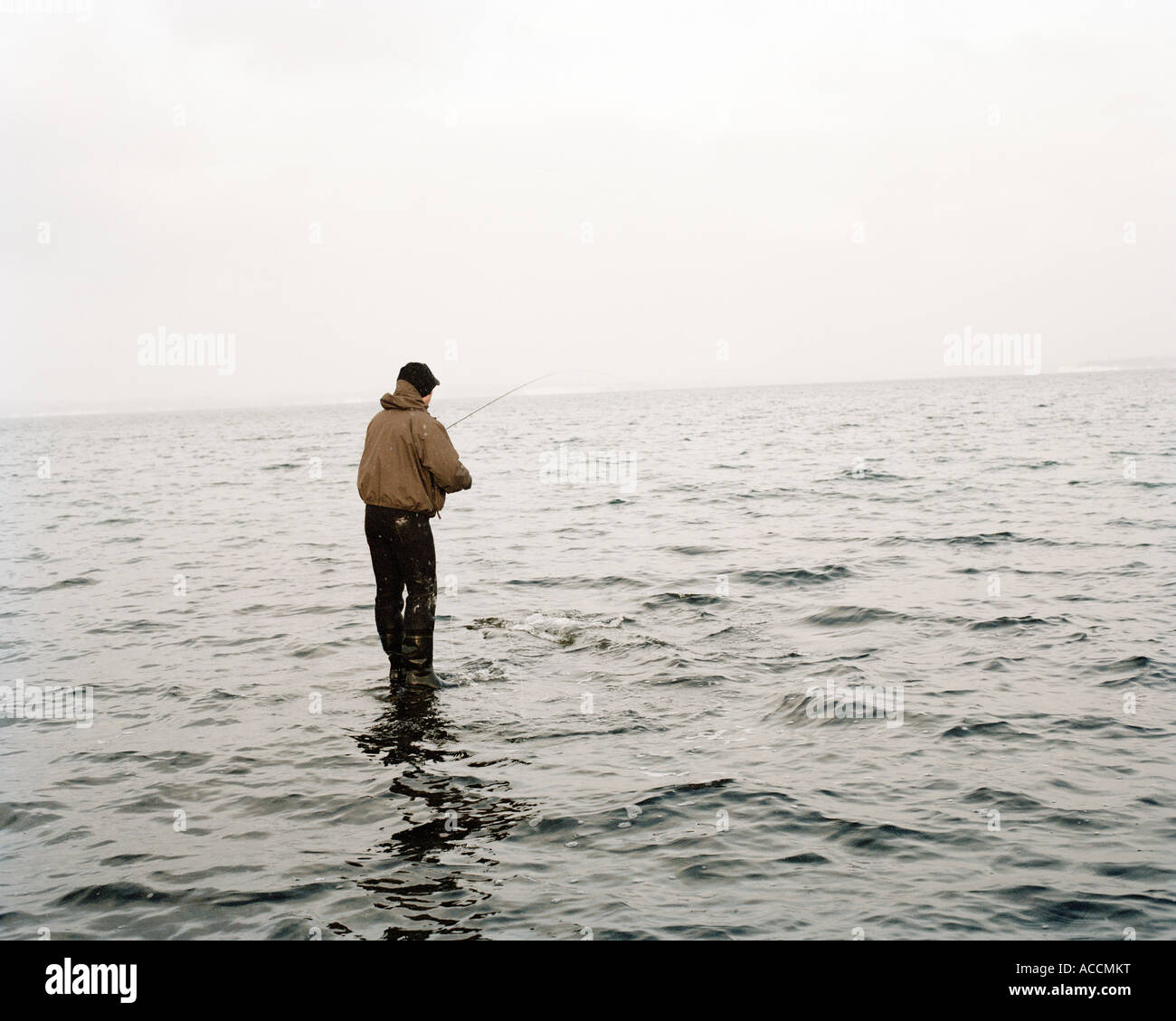 Man fishing in cloudy weather Stock Photo Alamy