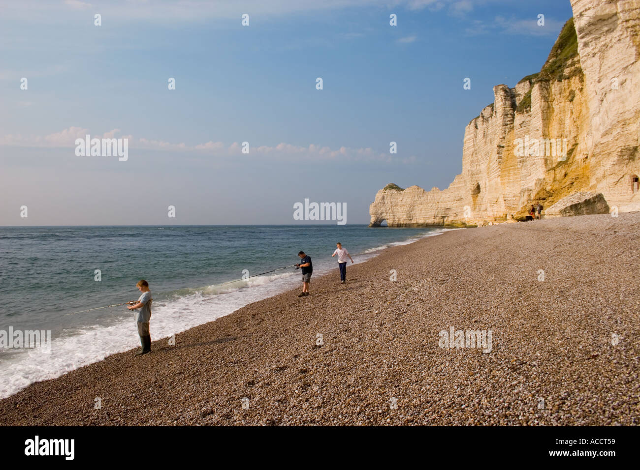 Fishermen in Etretat France fishing on the beach Stock Photo - Alamy