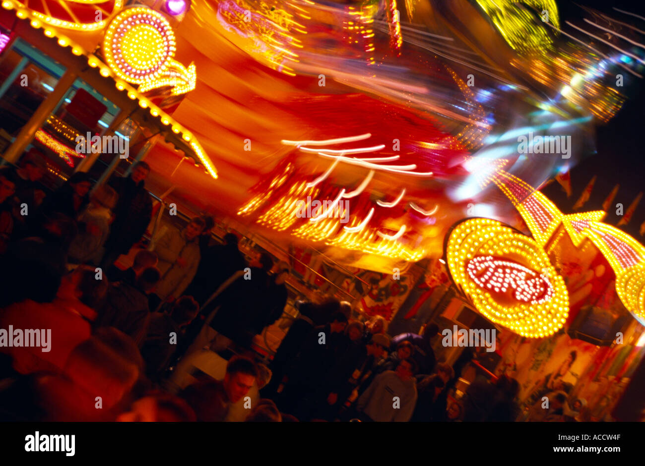 lighted merry go round and gaudy lights on fair fairground amusement