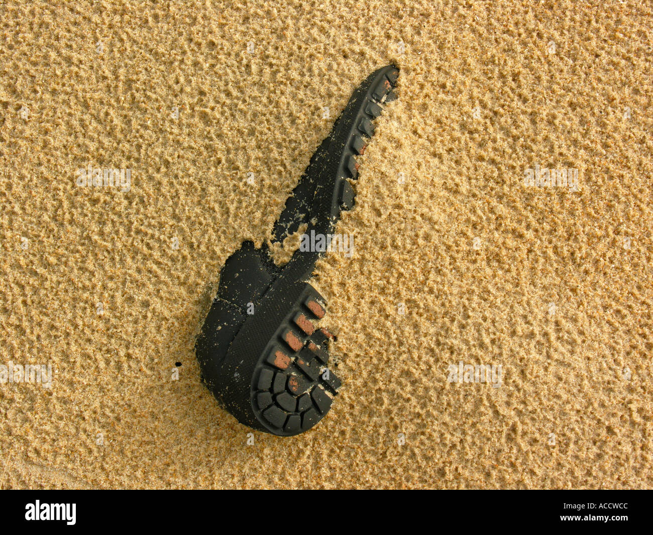 stranded goods shoe in sand Stock Photo
