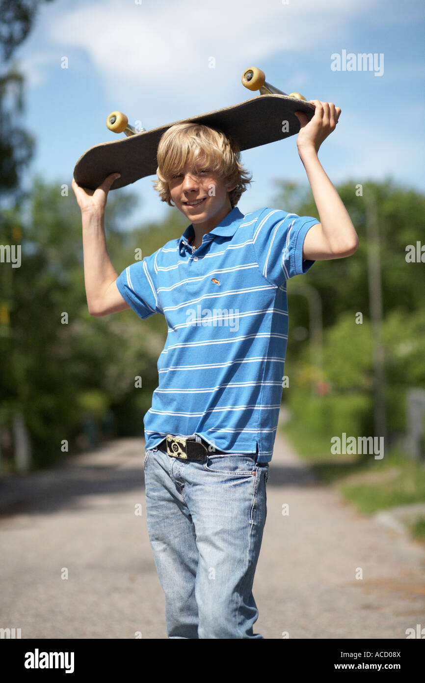 Portrait of a boy with a skateboard Stock Photo - Alamy
