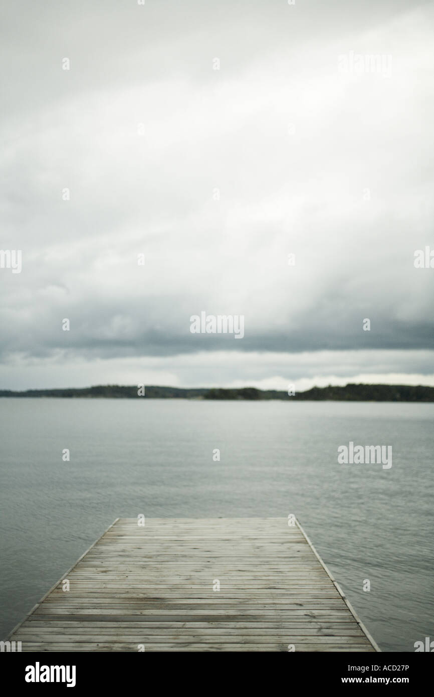 Cloudy sky over calm water Stock Photo - Alamy