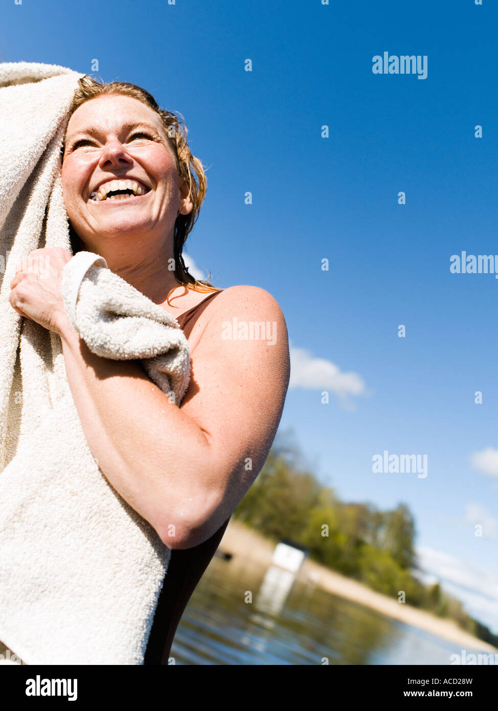 A woman drying after a swim Stock Photo Alamy