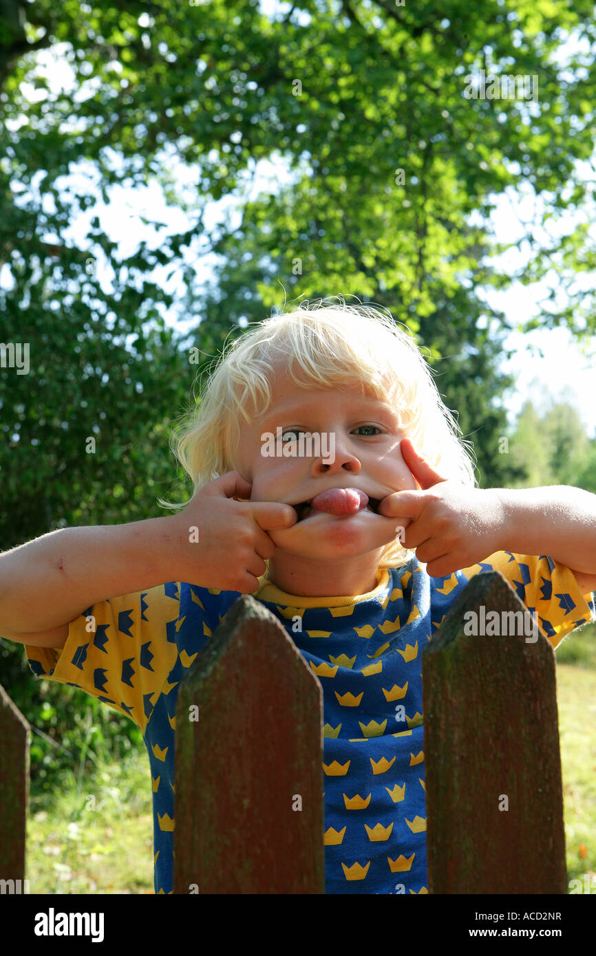 A blond boy making a face Stock Photo - Alamy