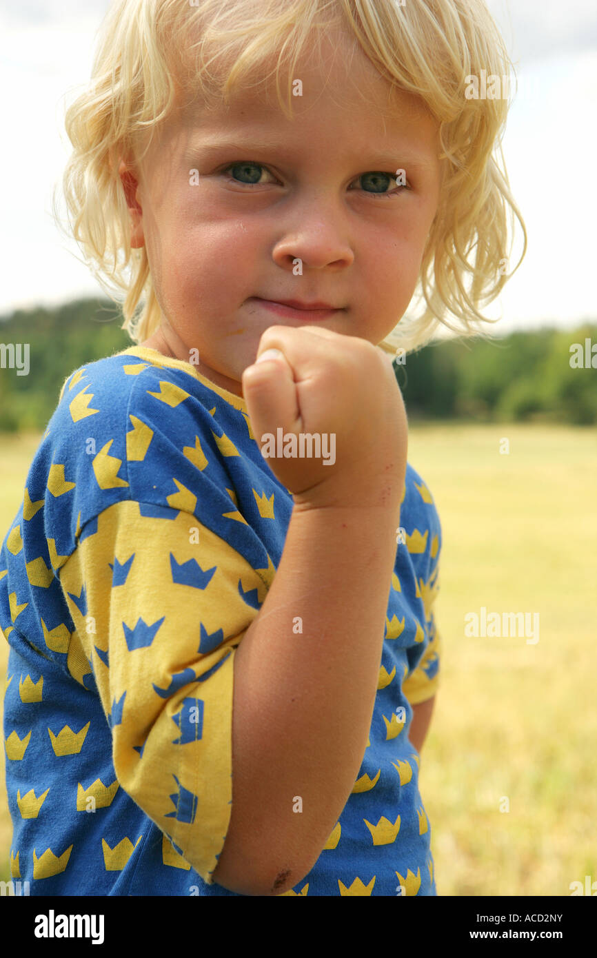 A boy with his fist clenched Stock Photo Alamy