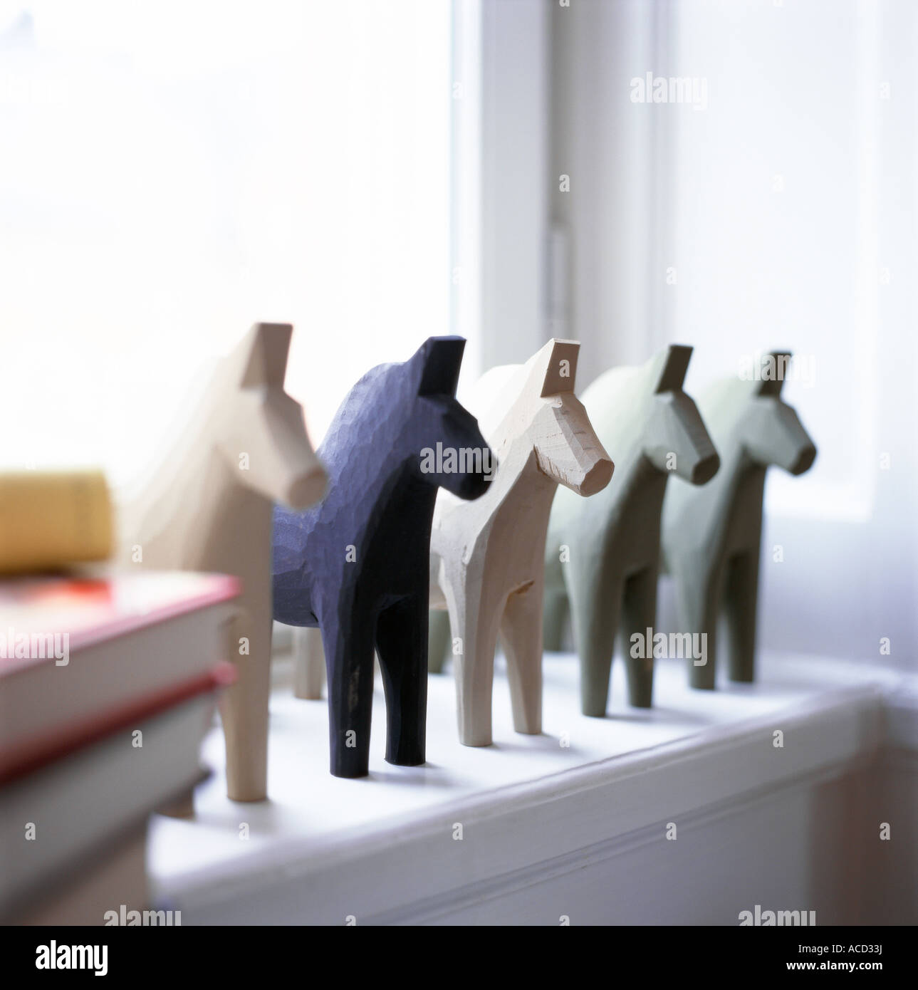 Dalecarlian horses in a window. Stock Photo