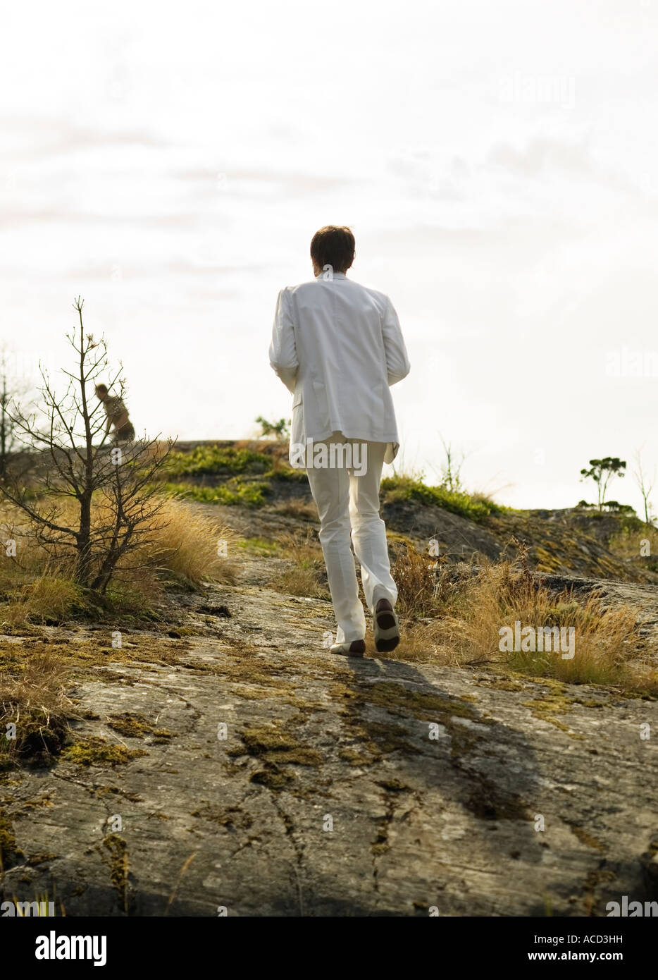 A man dressed in white from behind. Stock Photo