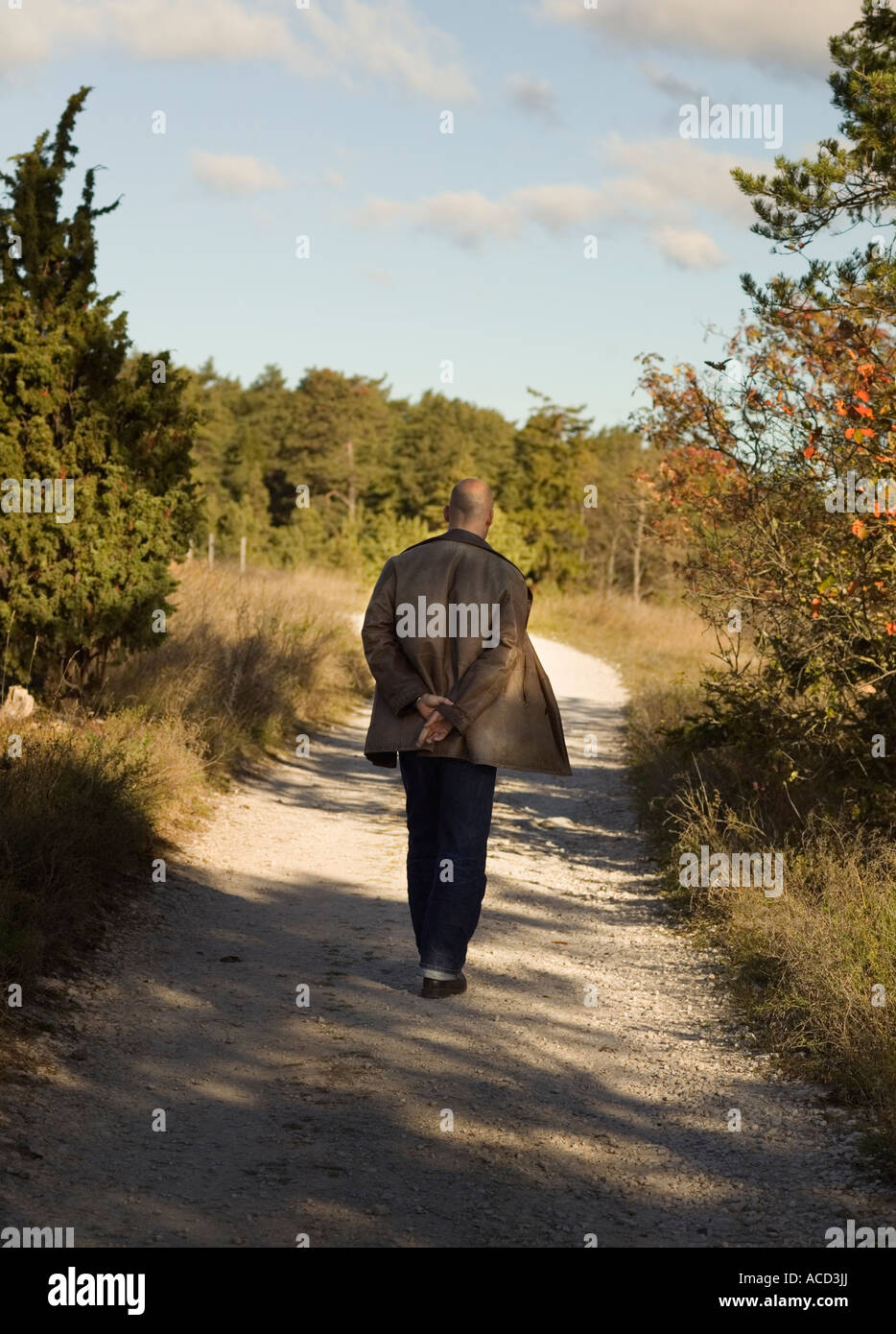 A man walking outside Stock Photo - Alamy