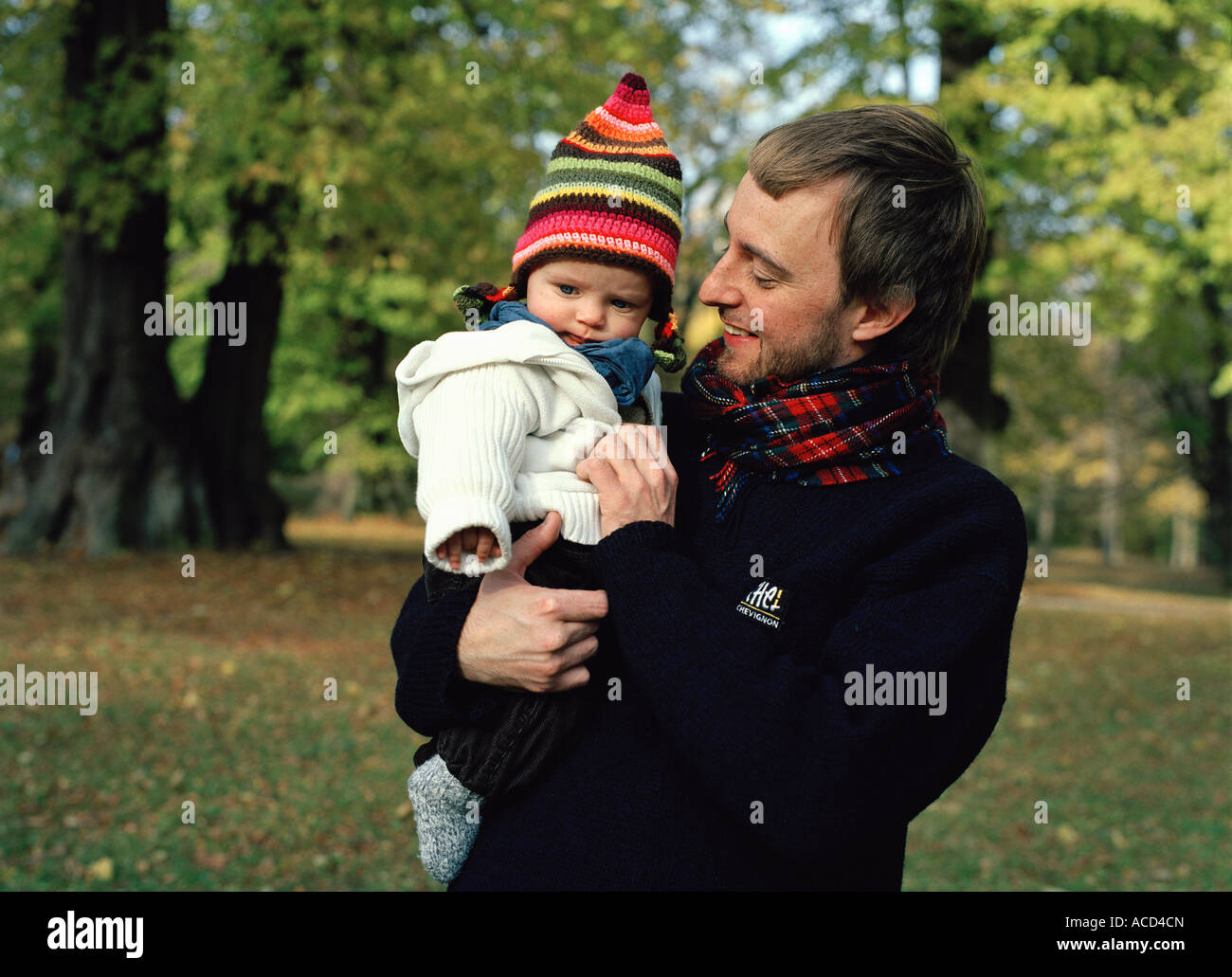 A child carried by its father Stock Photo - Alamy