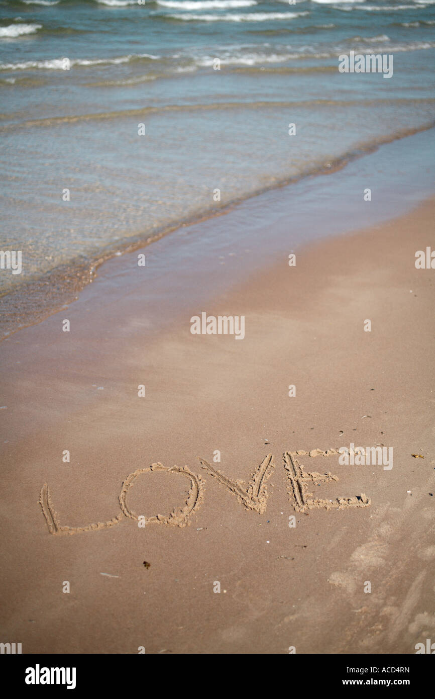 The word love written on a beach Stock Photo - Alamy
