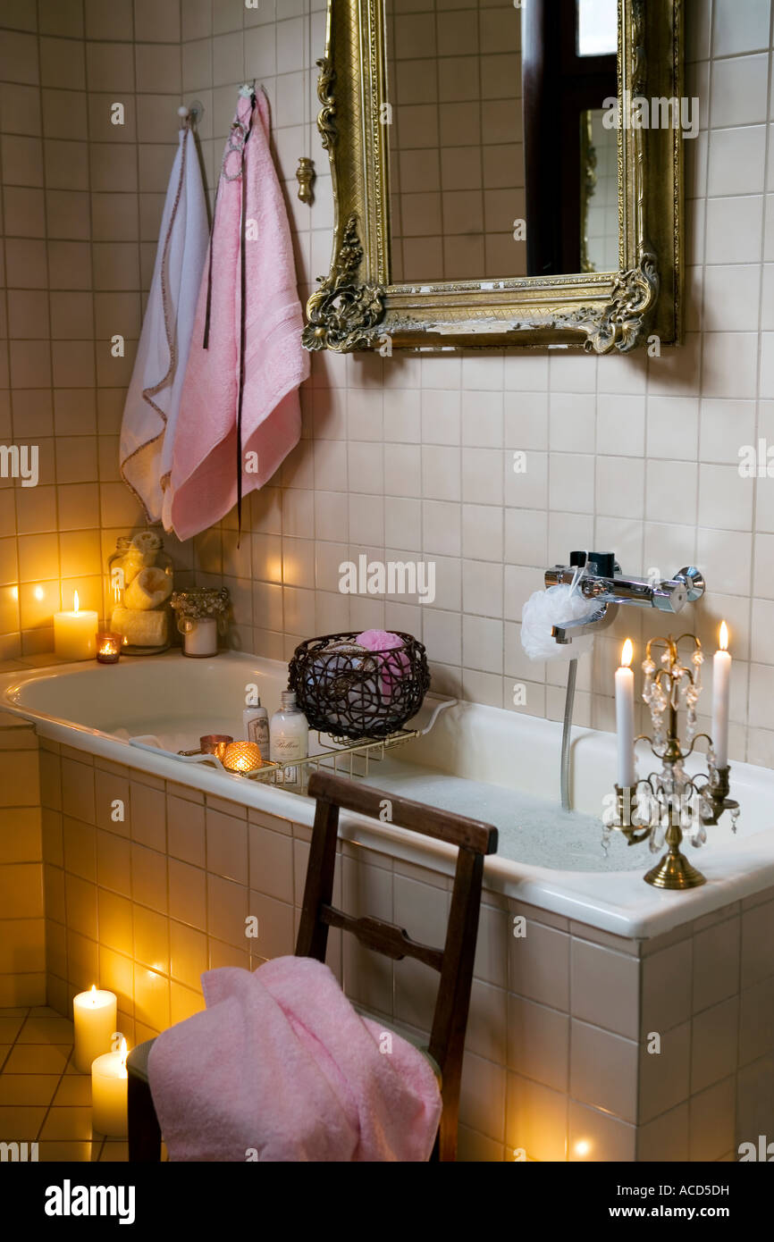 Lit candles by a filled bathtub Stock Photo Alamy