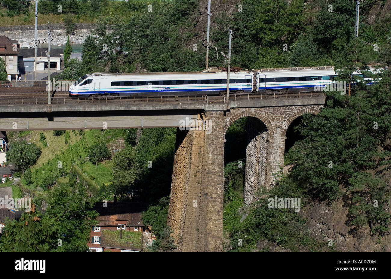 Italian passenger train Cisalpino crossing viaduct, Uri, Central Switzerland Stock Photo