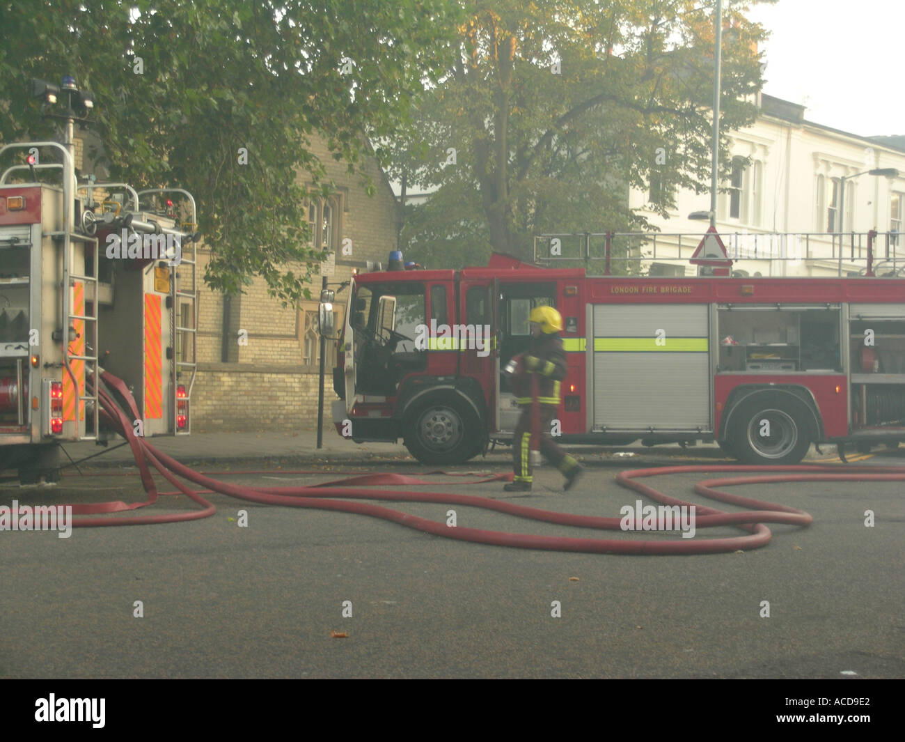 day London Fire Brigade attending a fire England Stock Photo