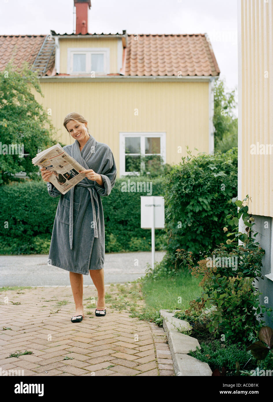 A woman in a dressing gown Stock Photo Alamy