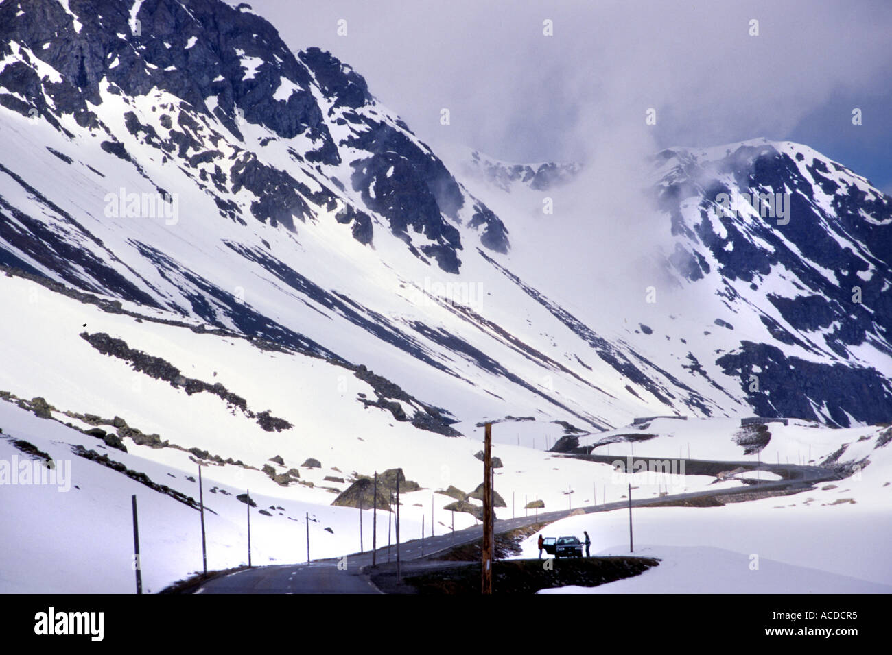 Switzerland  Snow Mountains Winter Ice White Road Pass Traffic mountain pass Stock Photo
