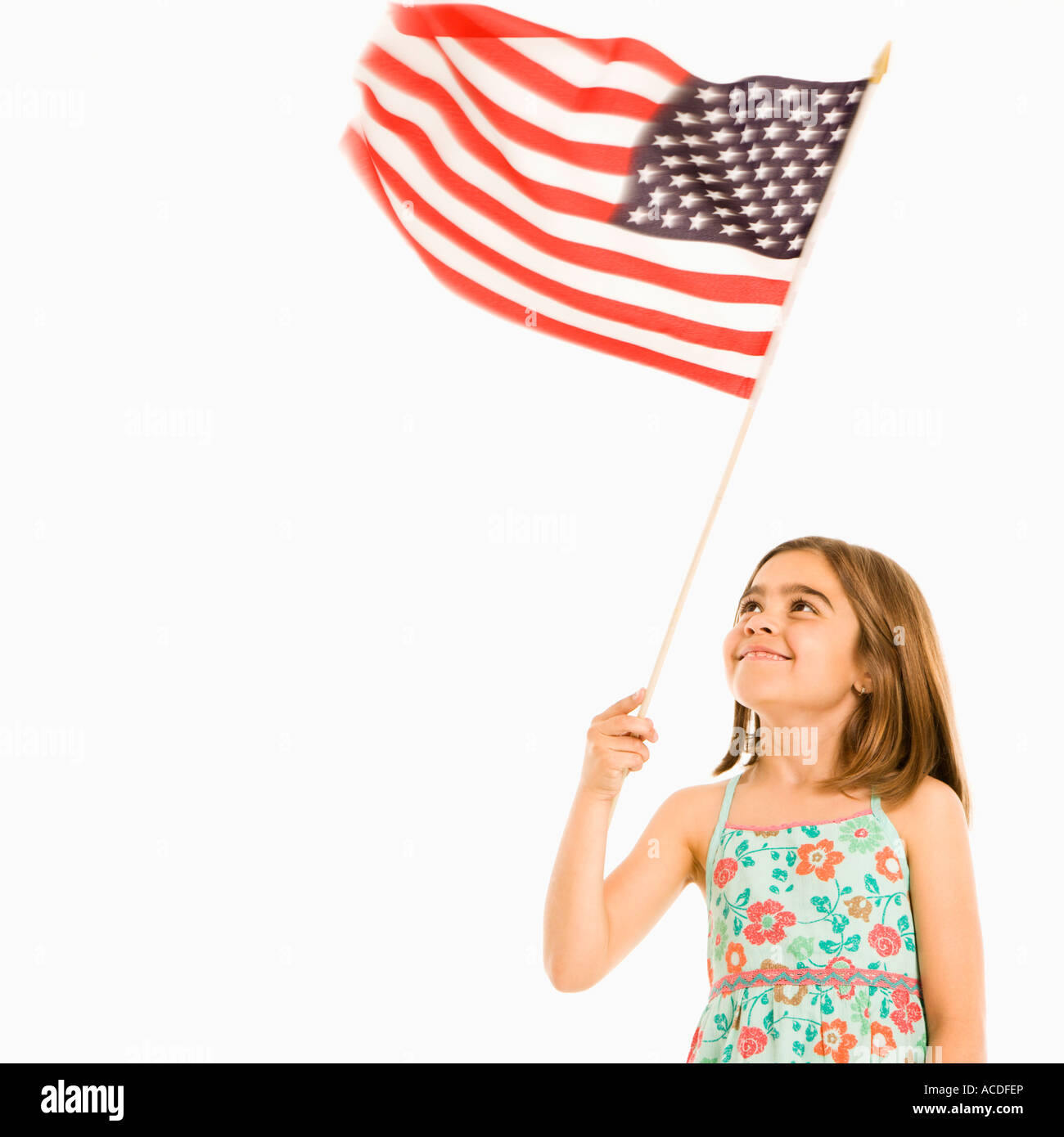 Girl holding American flag against white background Stock Photo - Alamy