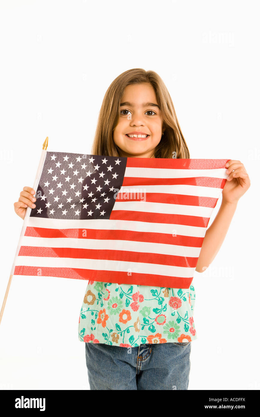 Girl holding American flag against white background Stock Photo - Alamy