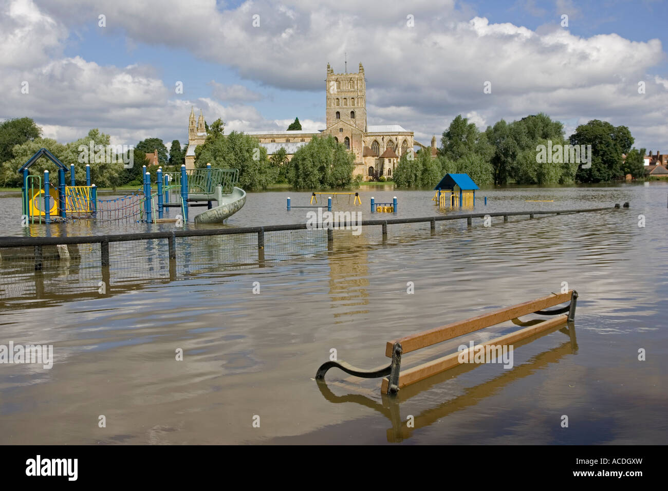 Flooded childrens playground near Tewkesbury Abbey during unprecedented floods July 2007 UK Stock Photo
