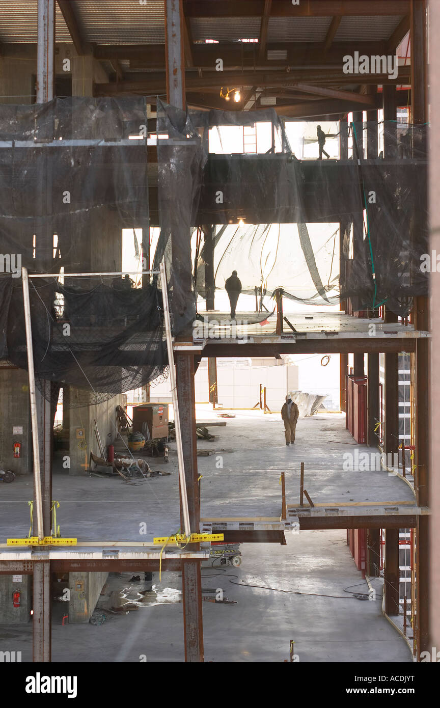 Building Under Construction With Worker Men Walking On Different Floors, Philadelphia, Pennsylvania USA Stock Photo