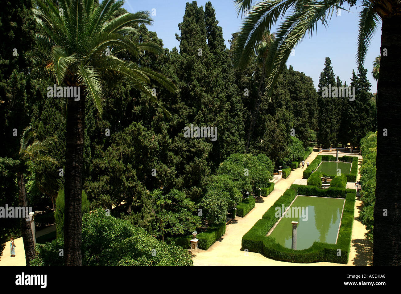 Walkway pool pond in Alcazar gardens Seville Andalucia Spain Sevilia Andalusia Espana España Stock Photo