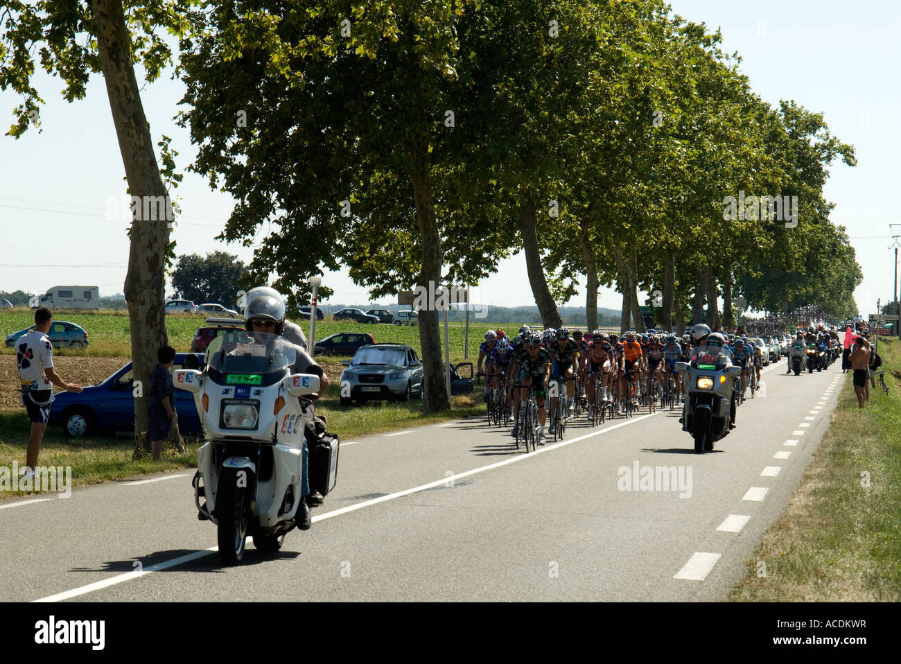 France Southwest Le Tour de France cycling race passes on a country road near Castelsarrasin 2007. Stock Photo